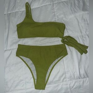 Bright green two piece, one shoulder, high waisted bikini.